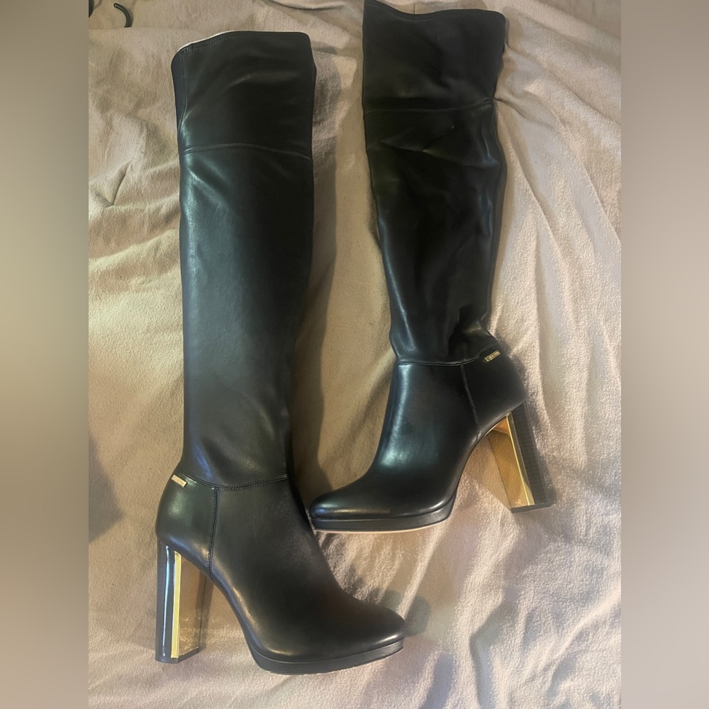 All black with gold trim and heel Calvin Klein thigh high boots
